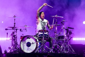 CHICAGO, ILLINOIS - AUGUST 04: Travis Barker of Blink-182 performs onstage during Lollapalooza at Grant Park on August 04, 2024 in Chicago, Illinois. (Photo by Natasha Moustache/Getty Images)