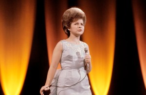 American singer Brenda Lee performs live on stage in London in 1964. (Photo by David Redfern/Redferns)